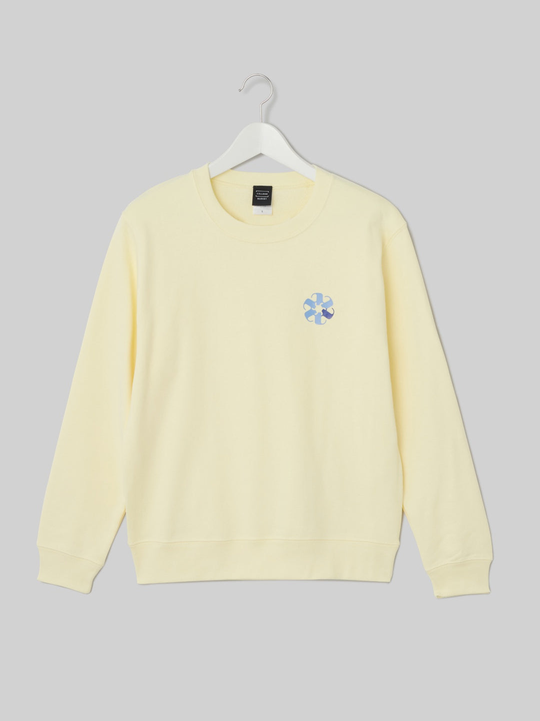 TAMAGAWA クルーネックスウェット コスモスロゴ フロストイエロー